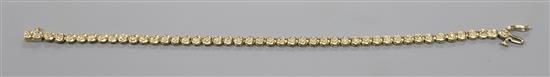 A 9ct gold and diamond set line bracelet,